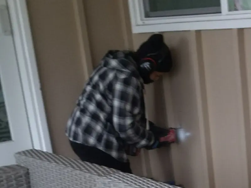 Professional electrician installing an exterior outlet in Cascades